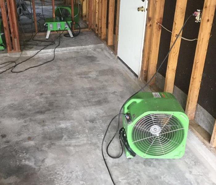 SERVPRO industrial grade fans placed on a concrete floor